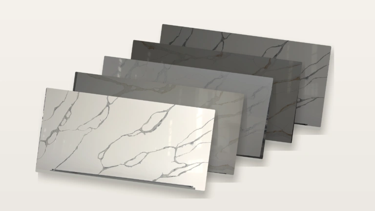 Quartz sample board collection featuring five white and gold veined surface designs