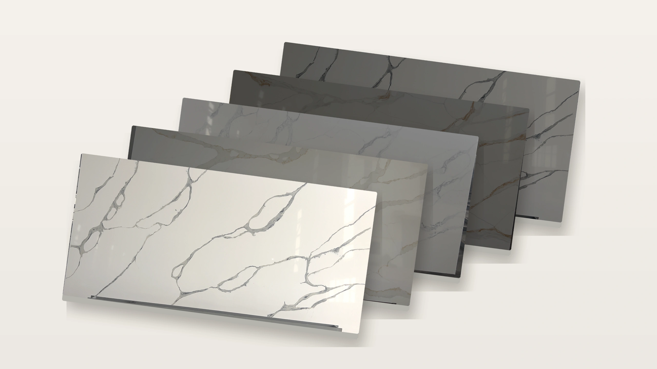 Quartz sample board collection featuring five white and gold veined surface designs